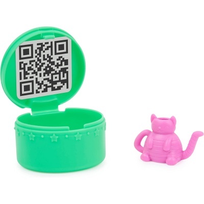 Brinquedo de plástico com base verde e pequeno gato rosa