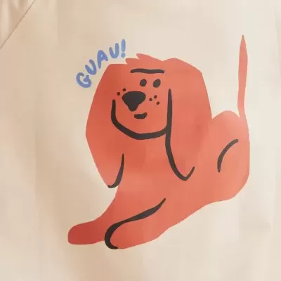 Camisola creme com estampa de cachorro laranja e texto GUAU!