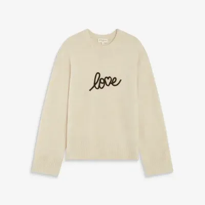 Camisola de malha bege clara com palavra love em preto no centro