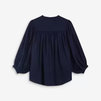 Blusa azul escura com mangas bufantes vista de costas
