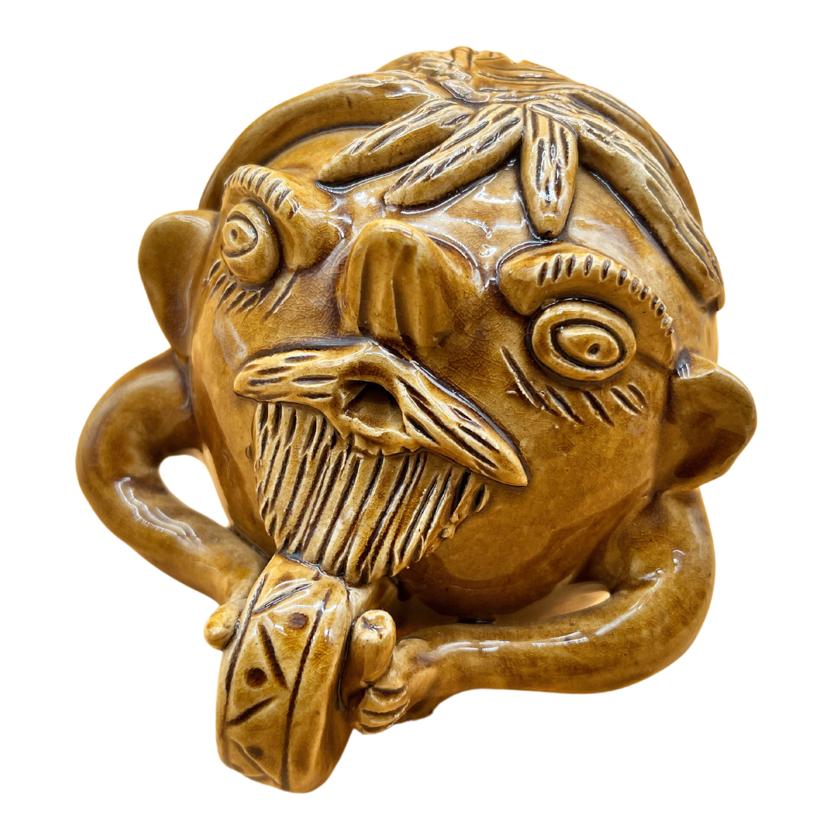 Objeto decorativo em cerâmica castanha em forma de cabeça humana estilizada