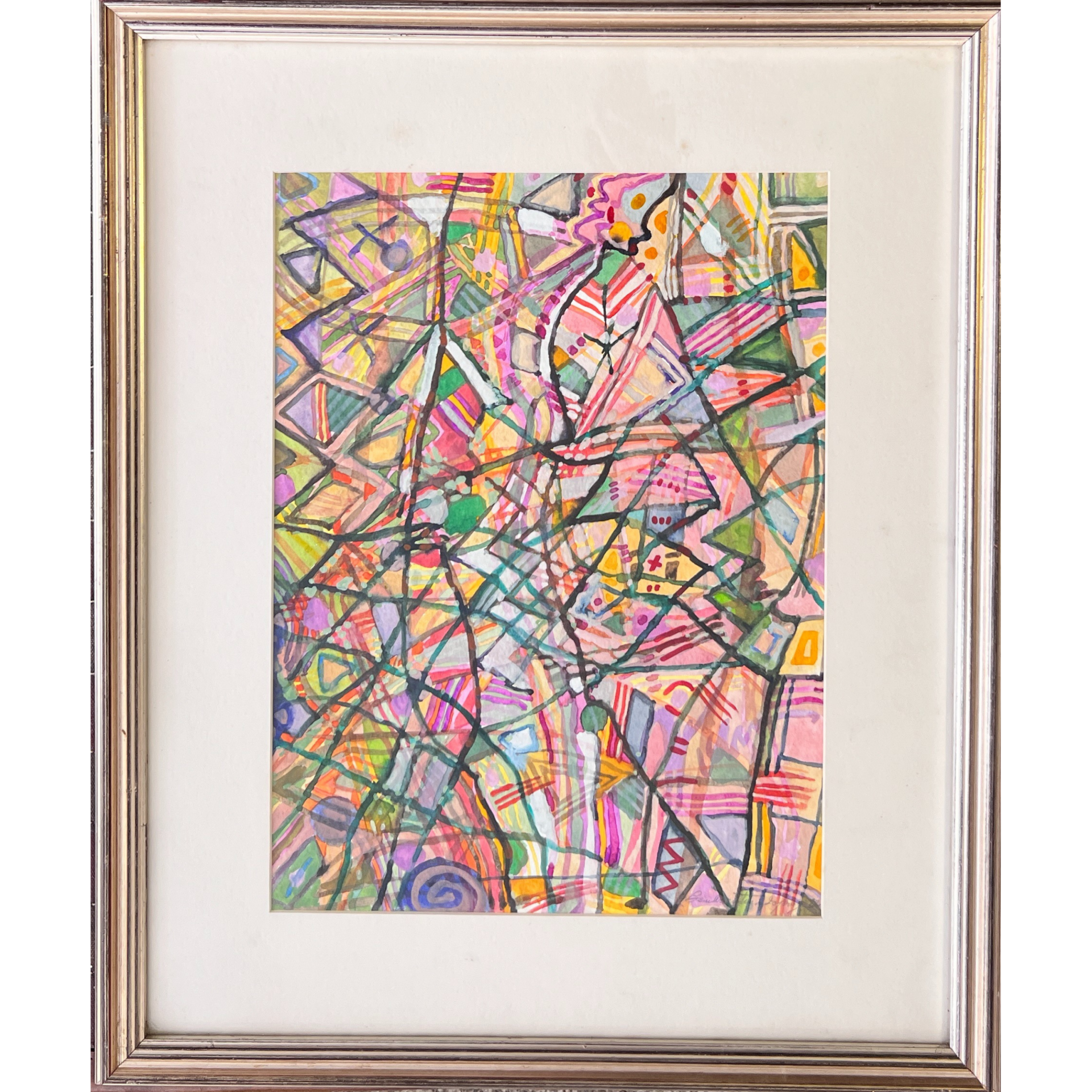 Pintura abstrata colorida em quadro com moldura prateada