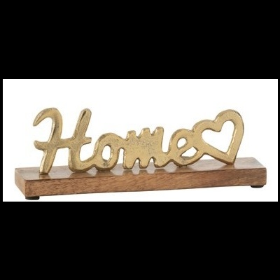 Objetos decorativos com palavra Home dourada sobre base de madeira