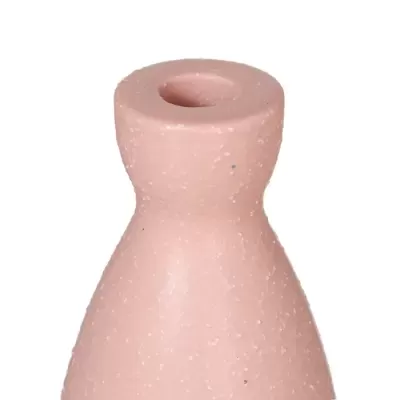 Castiçal de cerâmica cor de rosa com textura pontilhada