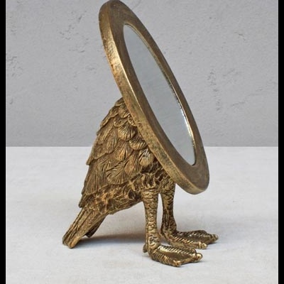 Espelho decorativo em bronze dourado com forma de pássaro