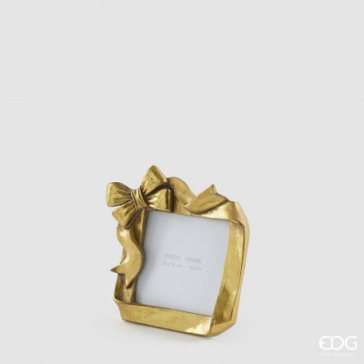 Moldura de fotografia dourada com laço decorativo