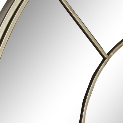 Espelho decorativo dourado com padrões geométricos