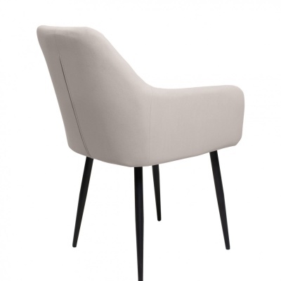 Cadeira estofada bege com pernas pretas finas