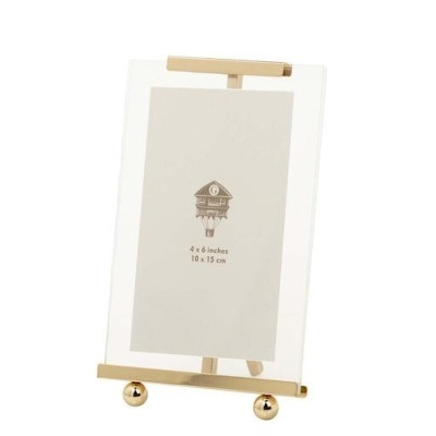 Moldura de fotografia transparente com suporte dourado em cavalete e espaço para foto