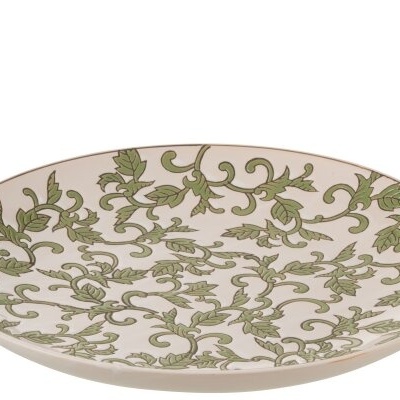 Prato raso branco com padrão de folhas verdes