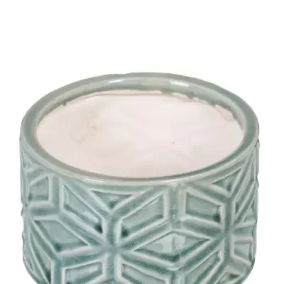 Vaso cerâmico verde-azulado com padrão geométrico em relevo