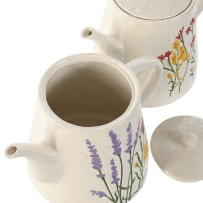 Conjunto de dois bules de cerâmica bege com decoração floral e tampa destacada