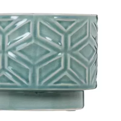 Vaso decorativo de cerâmica azul com padrão geométrico em relevo