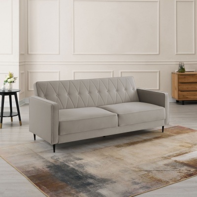 sofá cinza claro com padrão de costura losangos numa sala minimalista