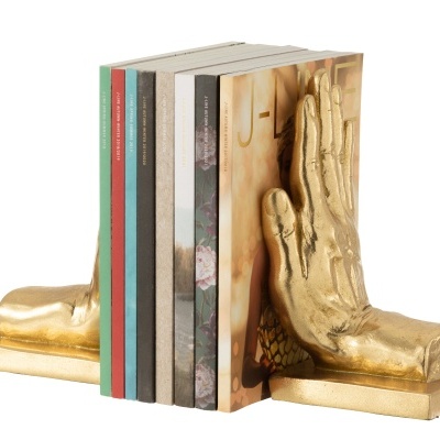 Suportes de livros dourados em forma de mão e pé segurando livros