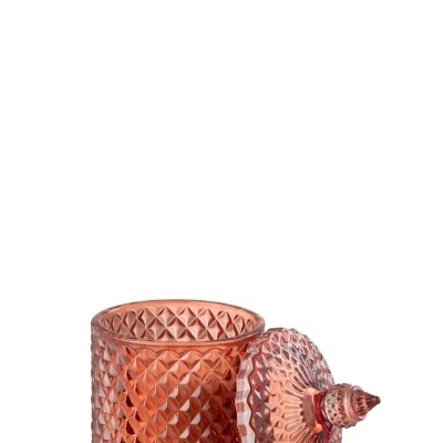 Recipiente de vidro rosa com tampa decorativa e tassel