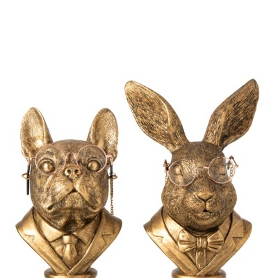 Estatuetas douradas de cachorro e coelho com óculos e roupas formais