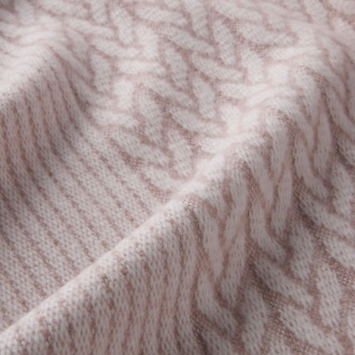 Tecido com padrão de malha rosa claro e bege