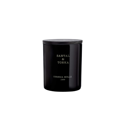 Vela perfumada em frasco preto com tampa e texto branco