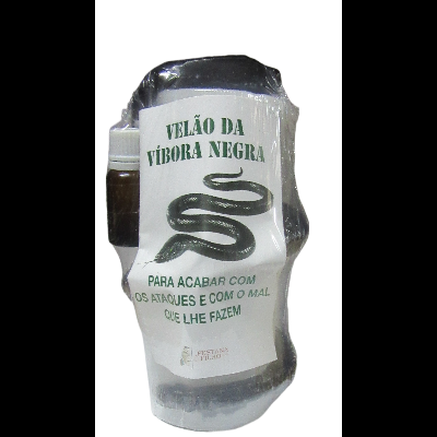 Vela com rótulo de víbora negra e pequeno frasco em embalagem plástica