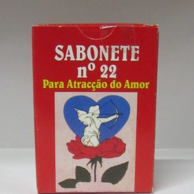 Embalagem de sabonete vermelho com texto e ilustração de anjo, rosa e coração