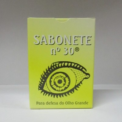 Embalagem amarela de sabonete com texto e desenho de olho