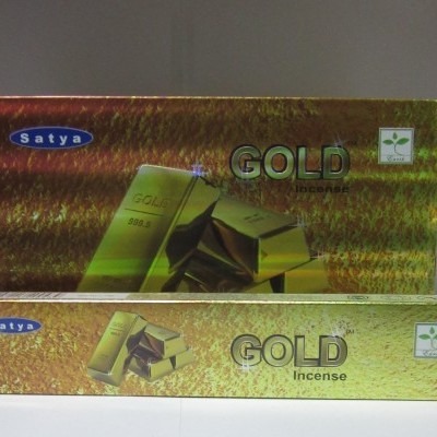 Embalagem dourada de incenso Satya Gold com barras de ouro na imagem