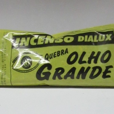 Pacote amarelo de incenso DIALUX com texto preto e desenho de olho