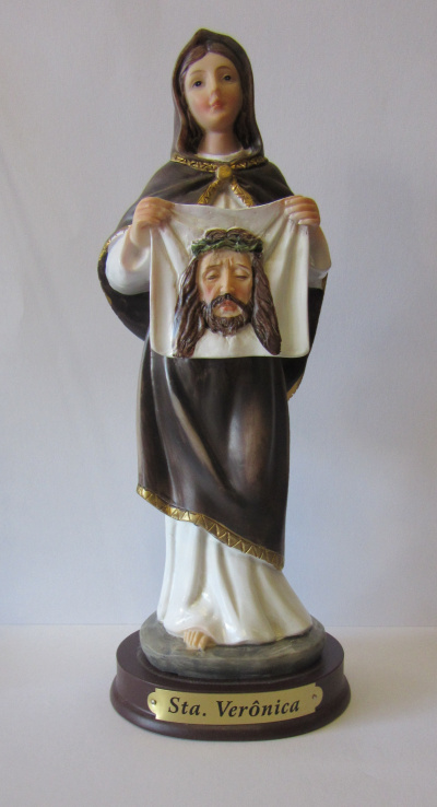 Estátua religiosa de Sta. Verónica segurando um pano com a face de Jesus