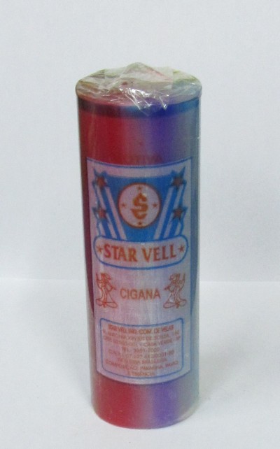 Vela cilíndrica vermelha e azul com etiqueta STAR VELL CIGANA