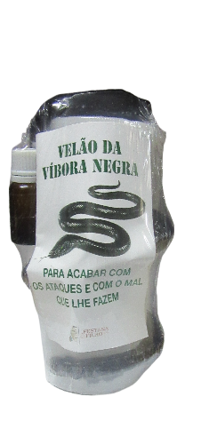 Vela com rótulo de víbora negra e pequeno frasco em embalagem plástica