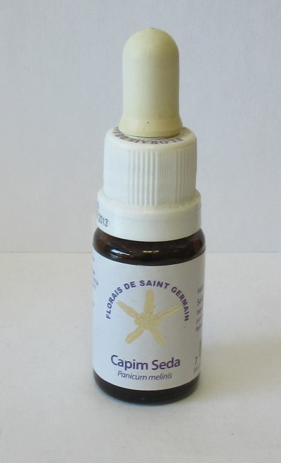 Frasco pequeno com conta-gotas e etiqueta de florais Capim Seda.