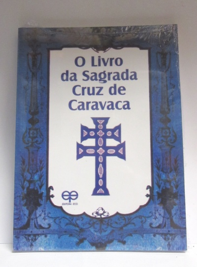 Capa de livro azul com título 'O Livro da Sagrada Cruz de Caravaca' e imagem da Cruz de Caravaca azul no centro