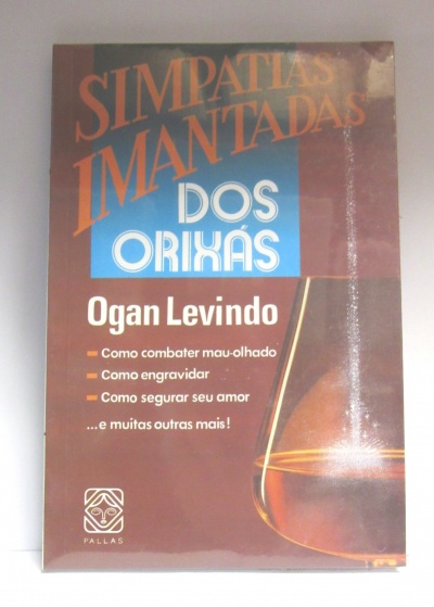 Capa de livro com textos 'Simpatiase Imantadas Dos Orixás' e autor 'Ogan Levindo' com fundo castanho e detalhes dourados.