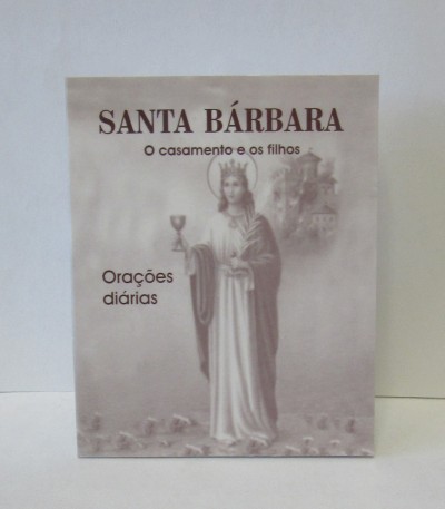 Livro com imagem religiosa de Santa Bárbara e texto na capa