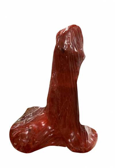 Objeto vermelho em forma fálica embalado em plástico transparente