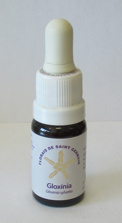 Frasco pequeno com conta-gotas e rótulo branco com texto roxo