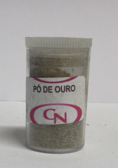 Frasco transparente com pó dourado e rótulo com texto PÓ DE OURO