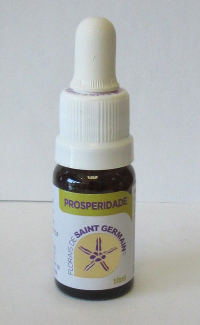 Frasco pequeno de vidro com conta-gotas branco e rótulo com texto PROSPERIDADE