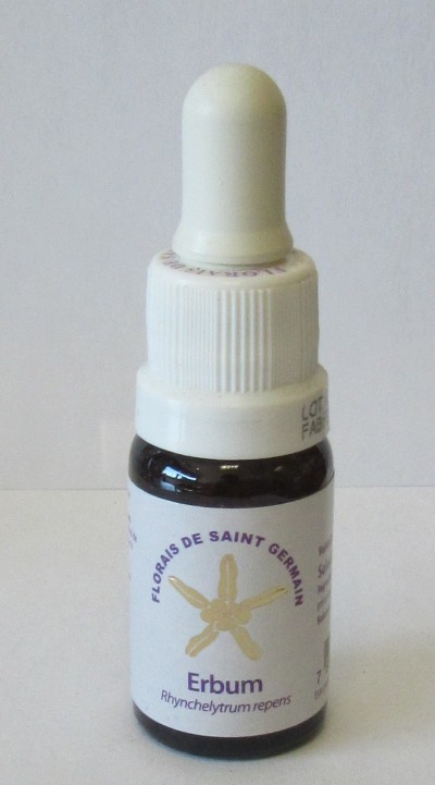 Frasco com conta-gotas e rótulo branco com texto e imagem de flor dourada