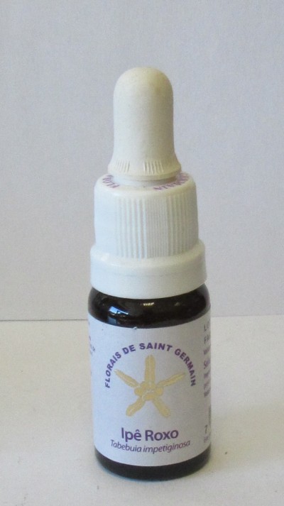 Frasco pequeno de essência Ipê Roxo com conta-gotas branco e rótulo com flor amarela