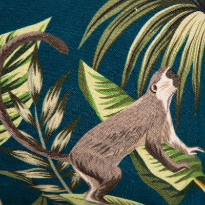 Tecido azul com estampa de macaco e folhas verdes