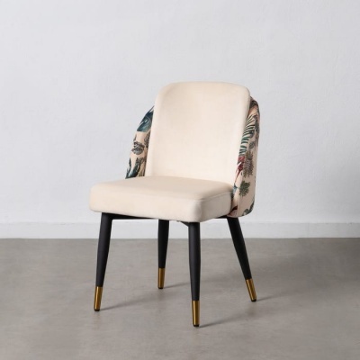 Cadeira com assento creme, costas florais e pernas pretas com pontas douradas