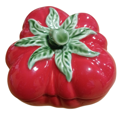 Frasco cerâmico em forma de tomate vermelho com folhas verdes