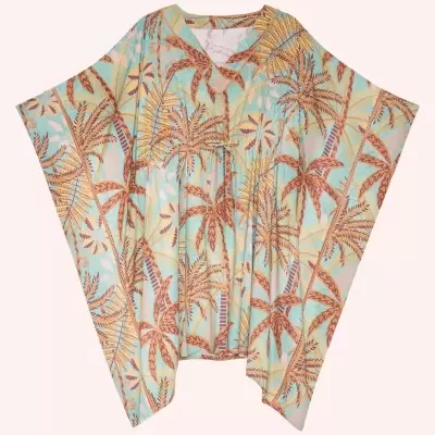 Poncho com padrão de palmeiras em azul, amarelo e castanho