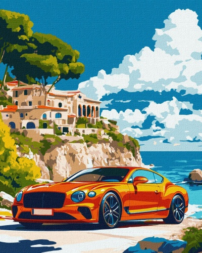 Carro desportivo laranja numa estrada costeira com falésia, casas e céu azul com nuvens.