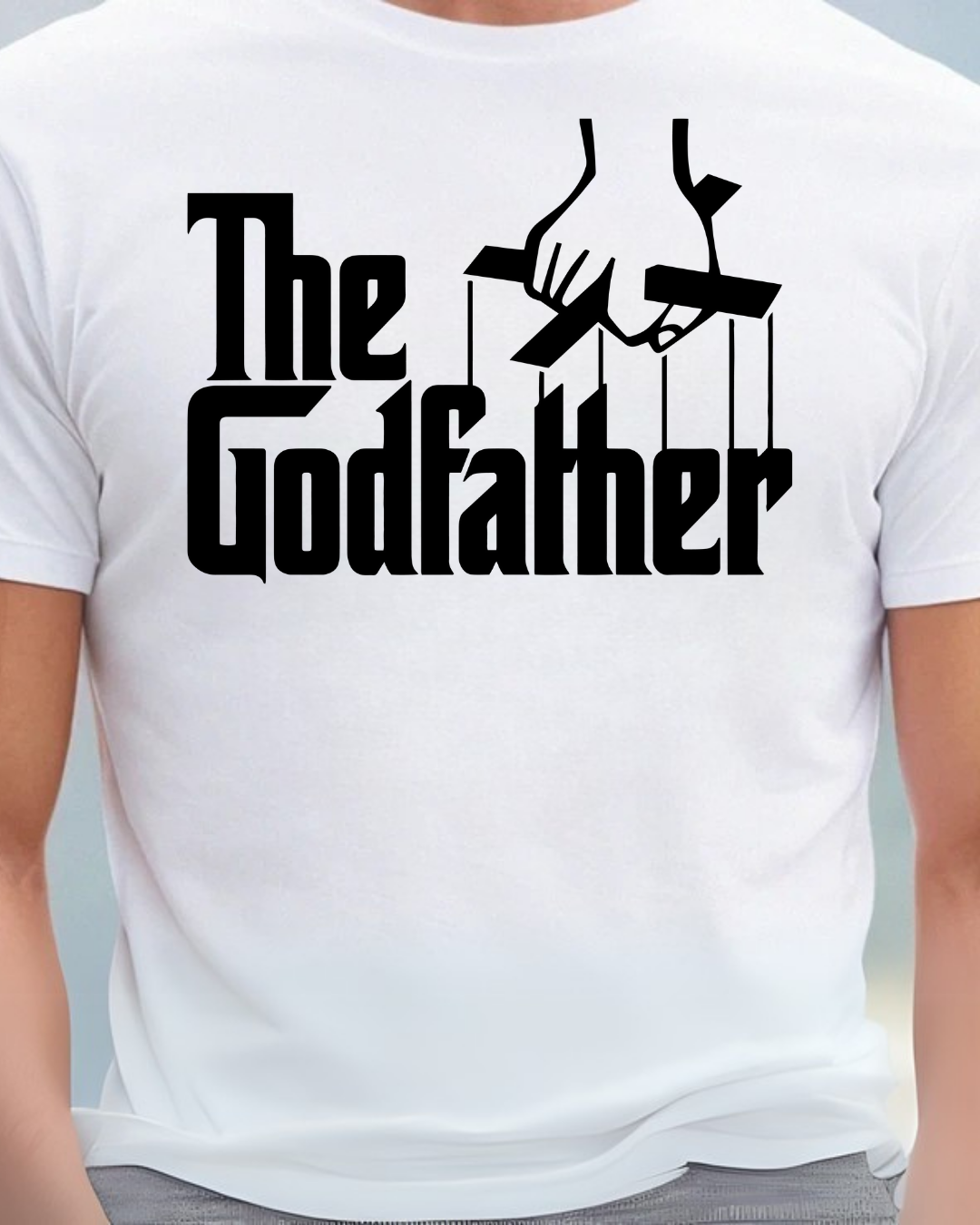 T-shirt branca com estampa preta The Godfather e mão segurando cordões de marionete