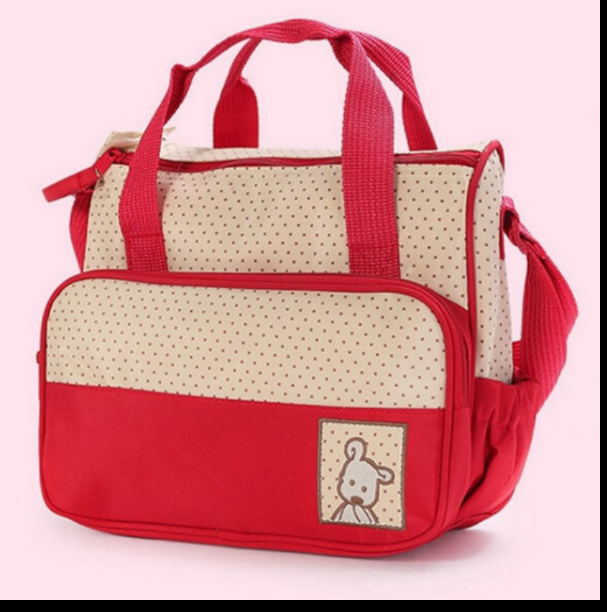 Bolsa de transporte para bebés vermelha e bege com padrão de pontos e desenho de coelho