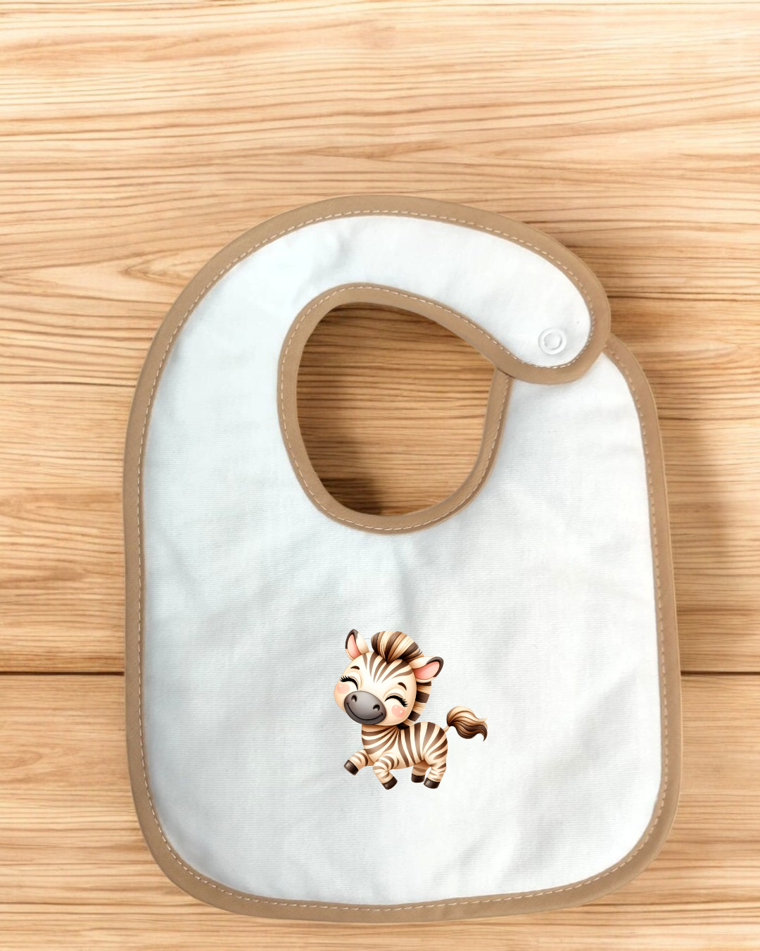 Babete branco com bordas castanhas e estampa de zebra sorridente