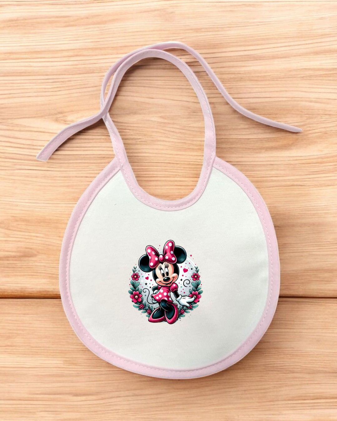 Babete branco com borda cor-de-rosa e estampa da Minnie Mouse